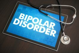 74913138 - bipolar lidelse (nevrologisk lidelse) diagnose medisinsk konsept på nettbrett med stetoskop.